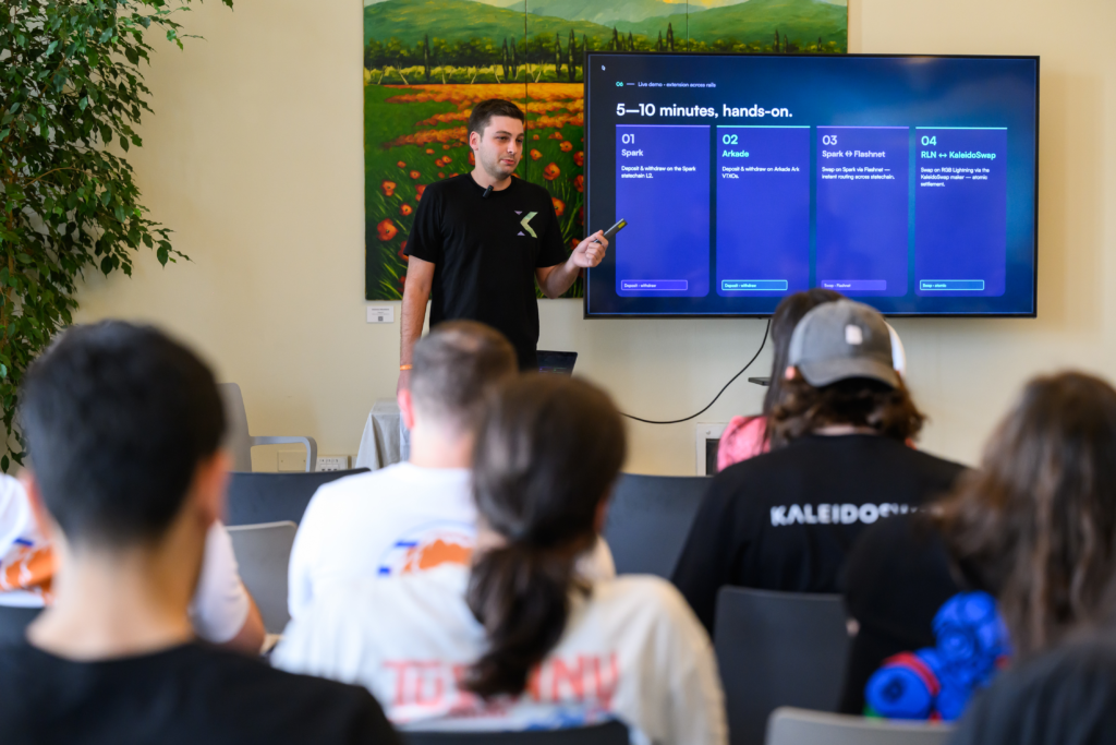 Walter Maffione presenting RGB atomic swaps on Bitcoin live demo at Tuscany Lightning Summit 2026 in Viareggio